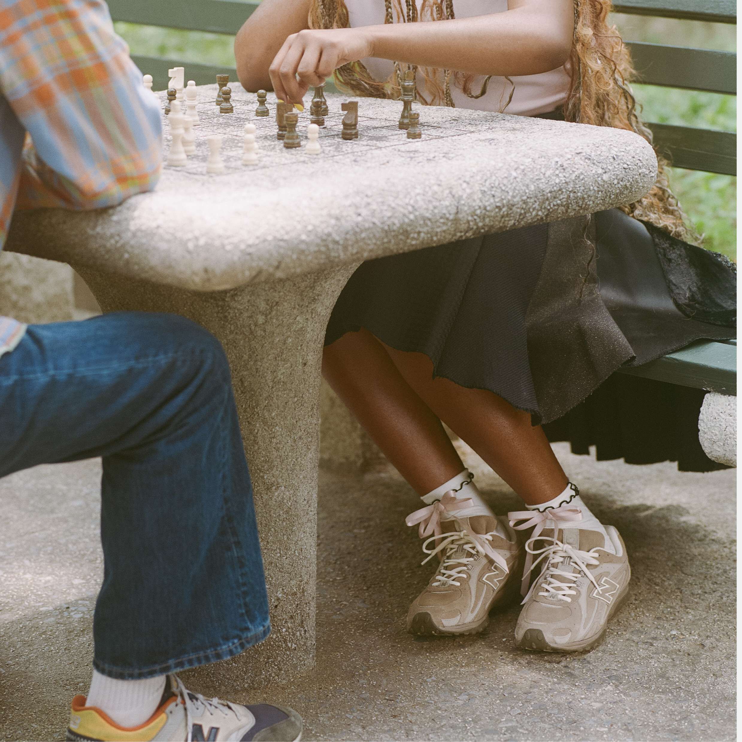 closeup of girl playing chess wearing 204L